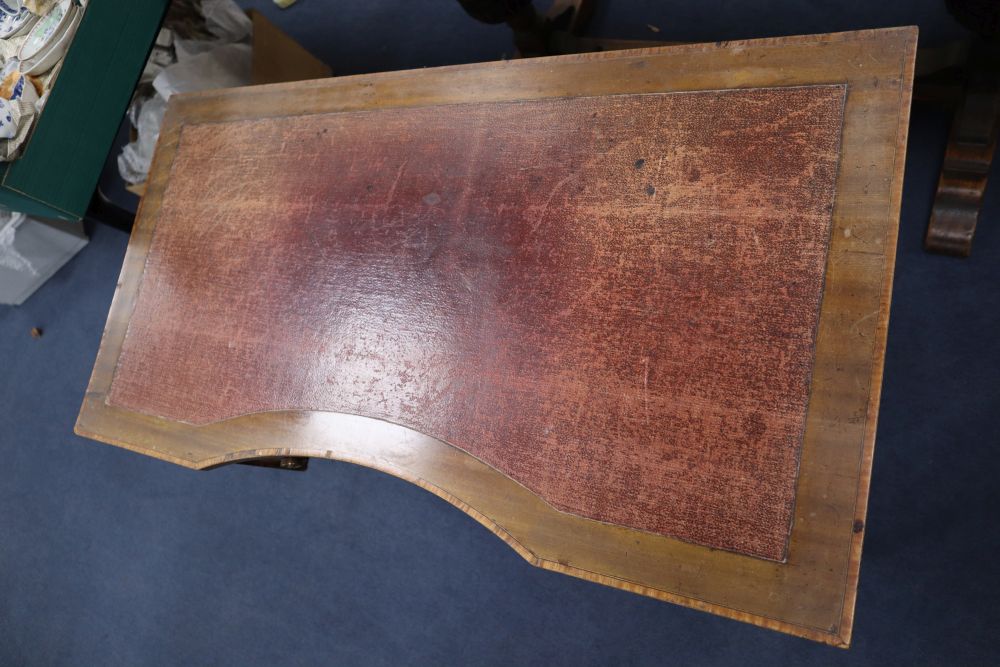 An Edwardian satinwood banded mahogany writing table, the concave front 98cm